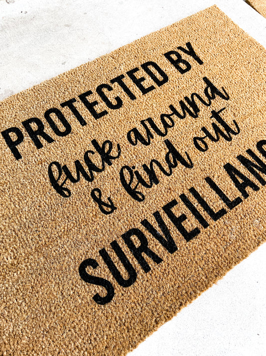 Protected by Fuck Around and Find Out Surveillance Mat